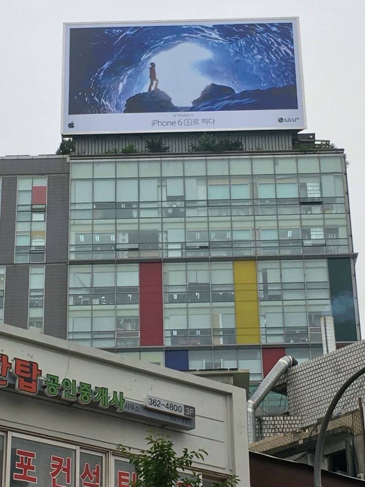 The photograph on a rooftop billboard in Seoul